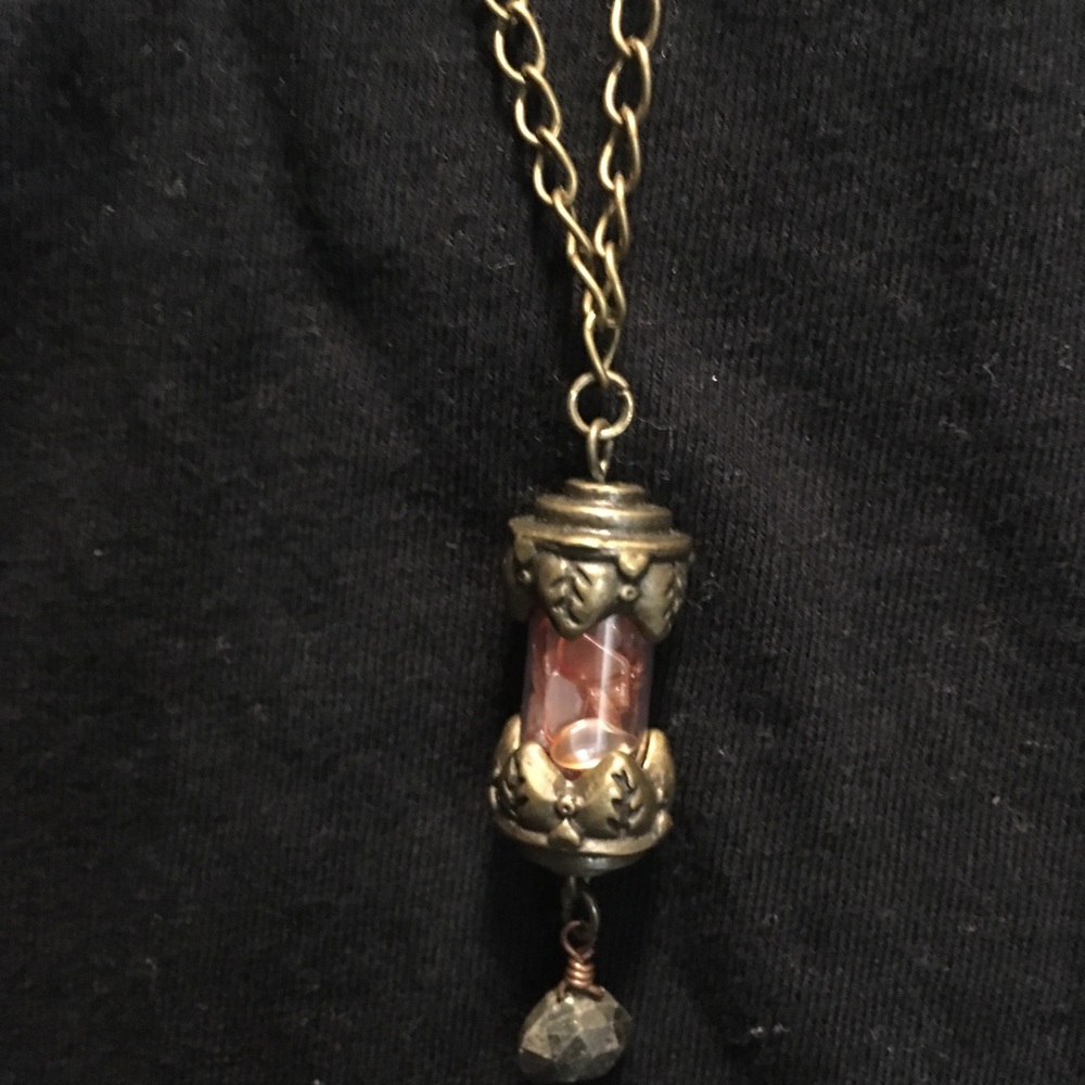 Carnelian chips in antiques brass vial w/ pyrite